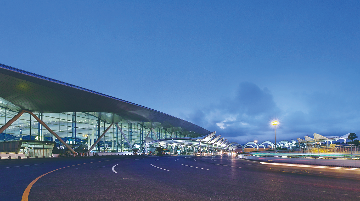 Night view of Guangzhou Baiyun International Airport Terminal 2 from the landside approach.