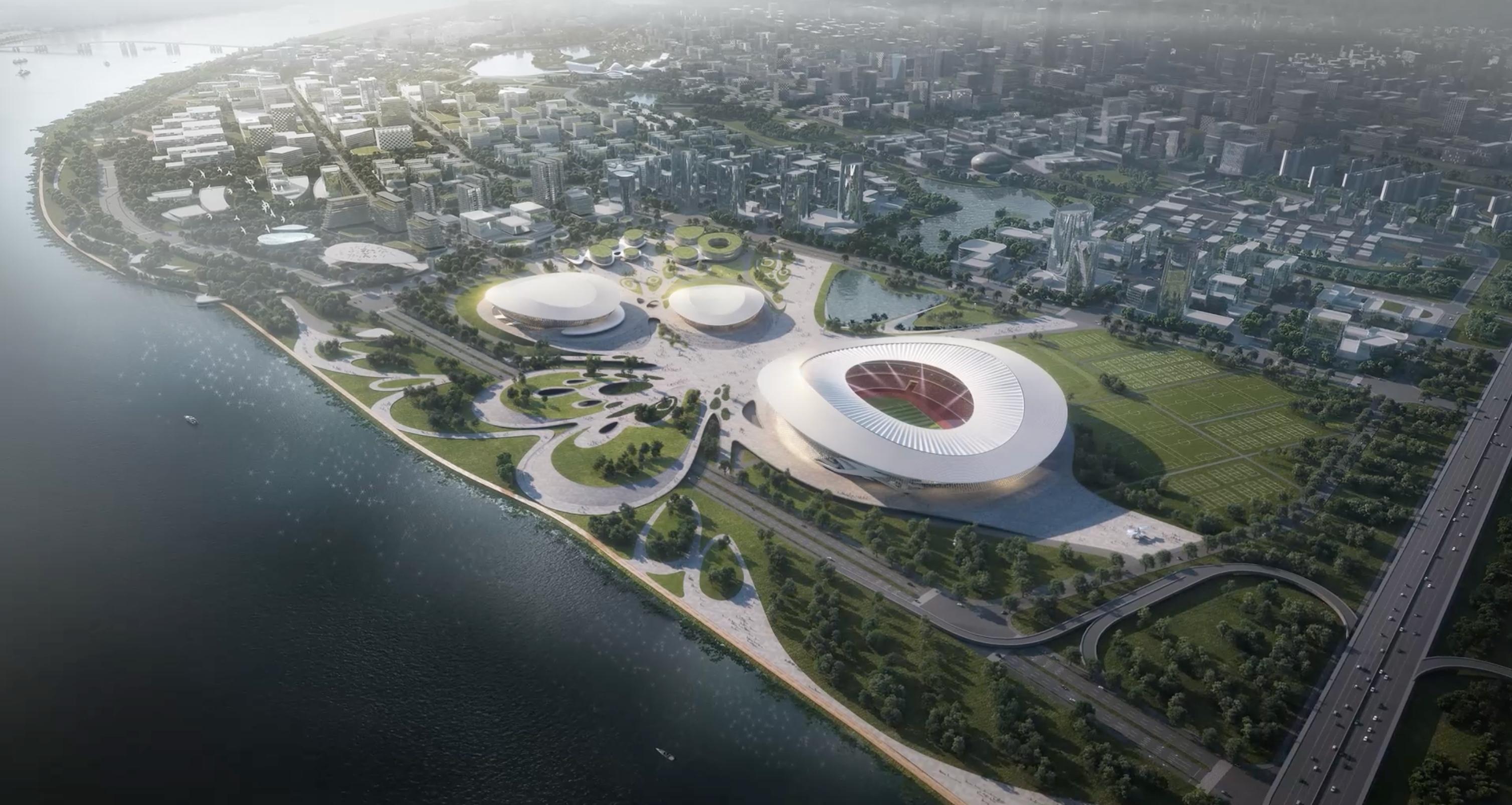Daytime aerial view of the Changsha Olympic Sports Centre competition scheme, showing the stadium, arena and aquatics hall along the river.
