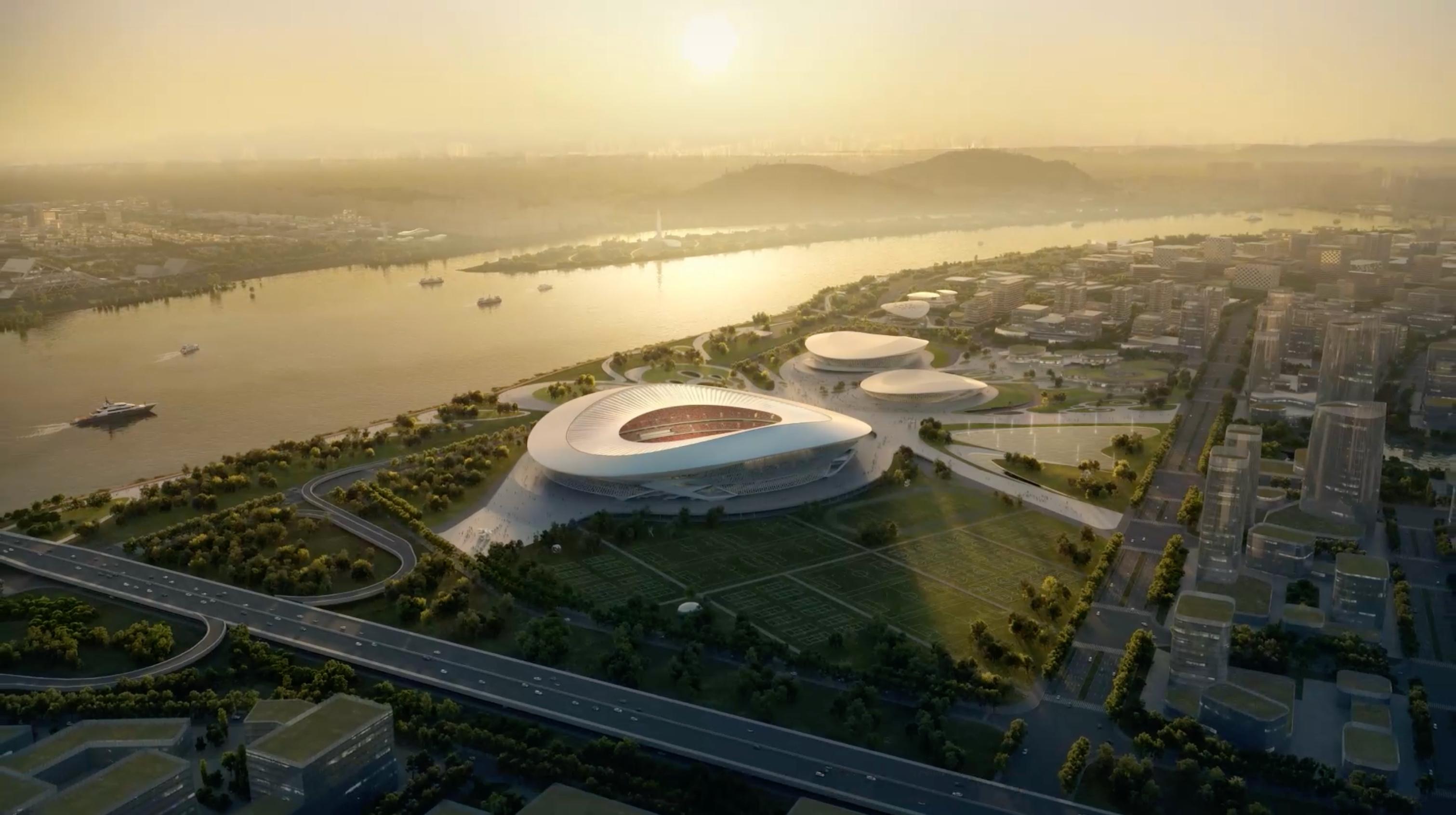 Dusk aerial view of the Changsha Olympic Sports Centre competition scheme along the river.