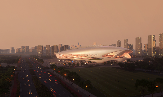 Dawn aerial view of the stadium site within the wider Guangzhou cityscape.