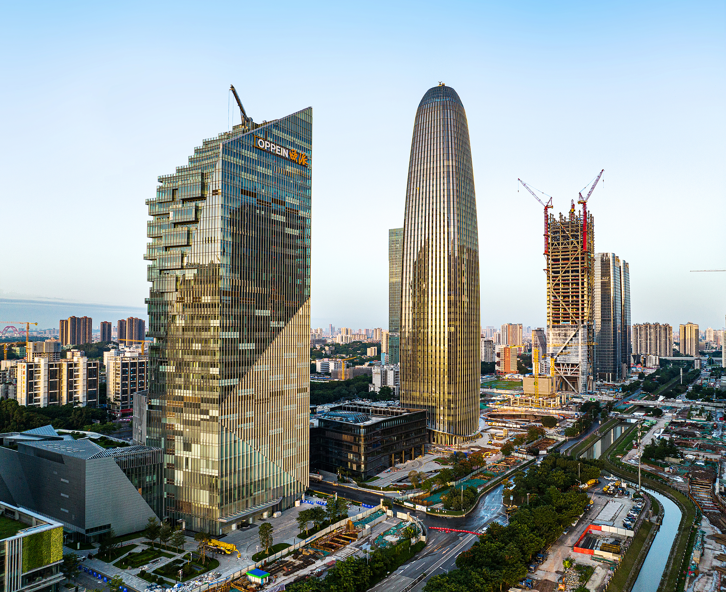 Aerial view of the headquarters tower under a clear sky, showing its relationship to surrounding CBD towers.