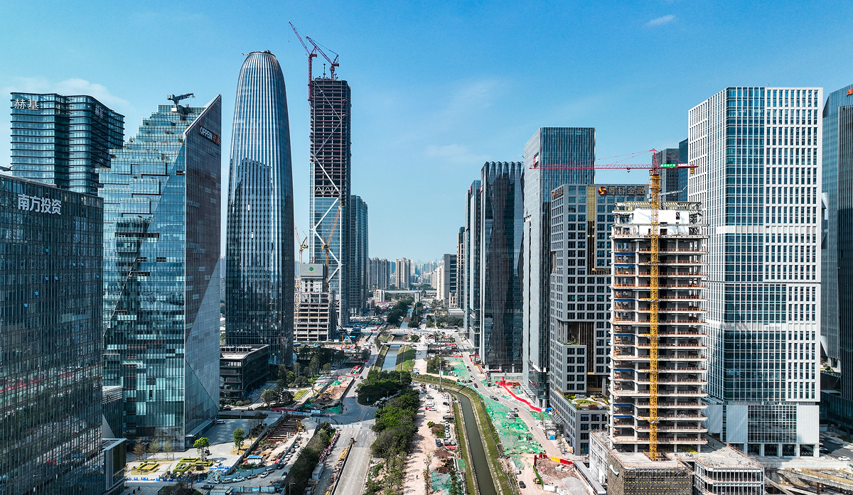 Aerial view showing the building's position along the Pazhou CBD waterfront axis.