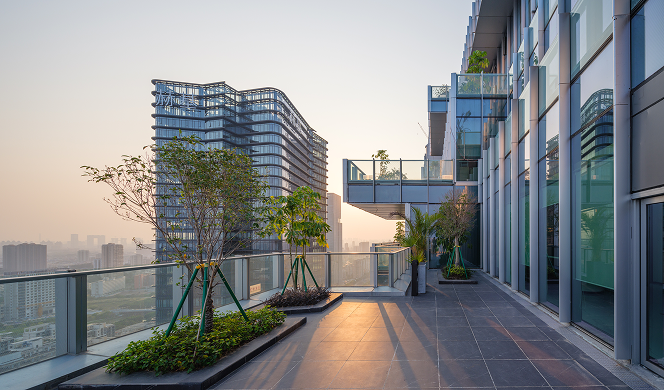 View of a sky garden terrace with planting and seating.