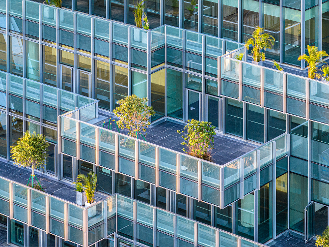 Aerial view of a sky garden terrace surrounded by the tower's facade.