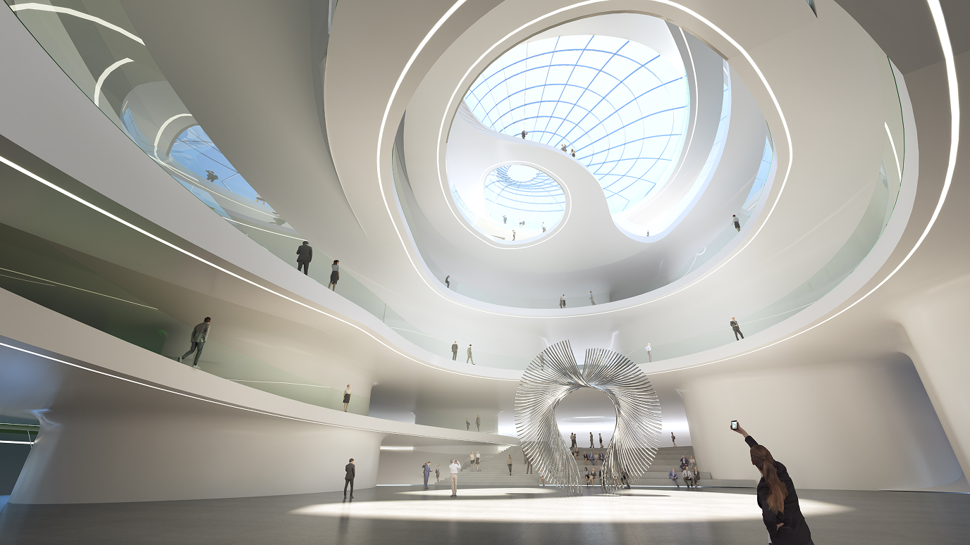 Interior view of the exhibition hall's atrium showing a ring-shaped skylight, layered walkways and visitors moving through the central space.