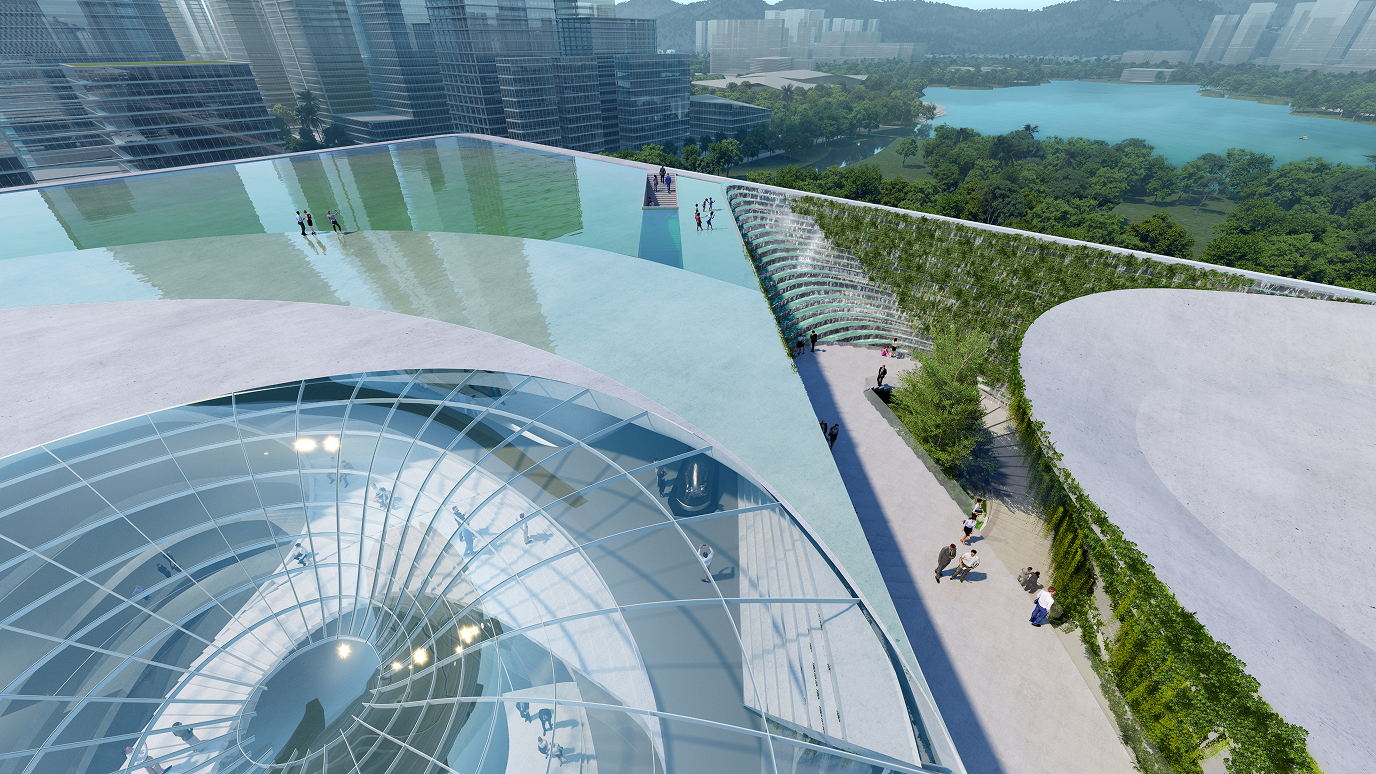 Aerial view of the exhibition hall's elevated glass rooftop terrace and adjoining green pathway, with the city and a lake visible beyond.